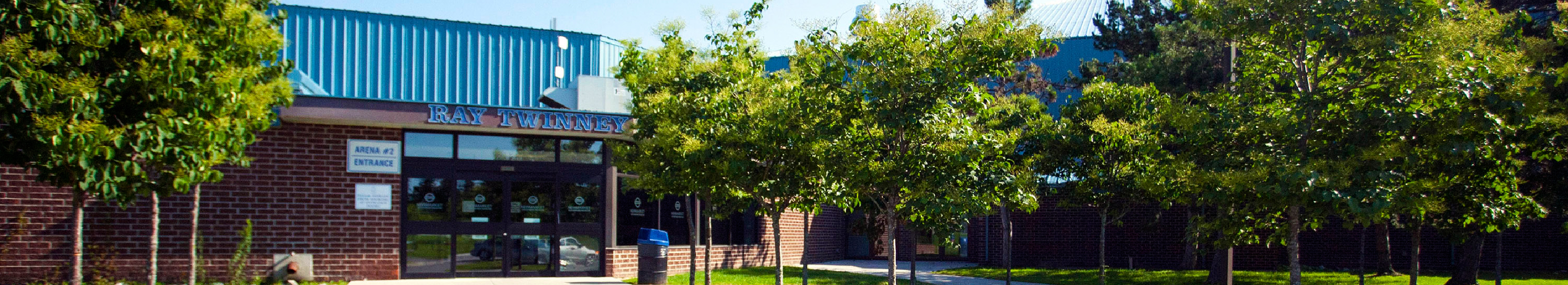 A sports complex behind trees